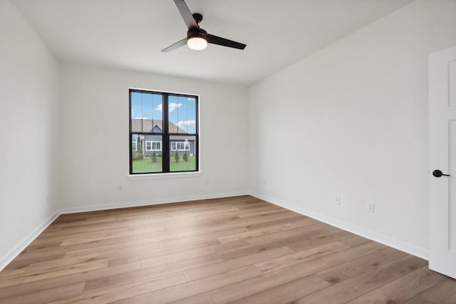 spare room with ceiling fan and light hardwood / wood-style floors