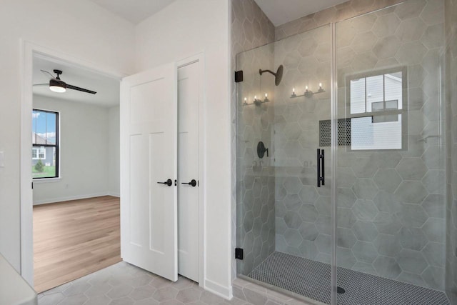 bathroom featuring tile patterned floors, ceiling fan, and walk in shower