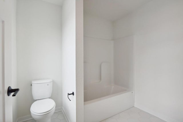 bathroom featuring tile patterned floors and toilet