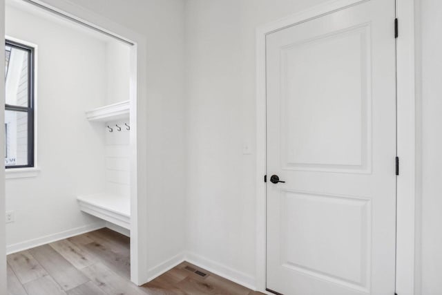 mudroom with light hardwood / wood-style flooring