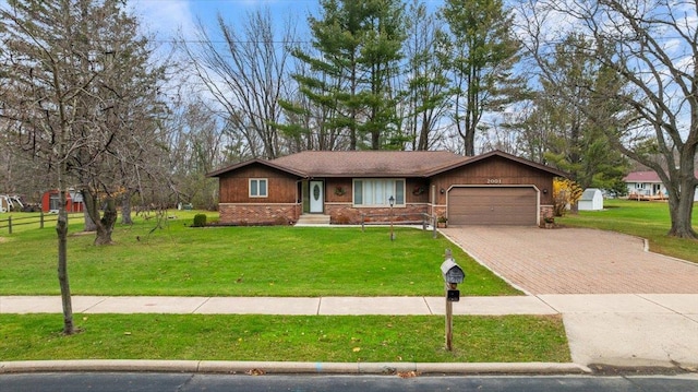 single story home featuring a front lawn and a garage