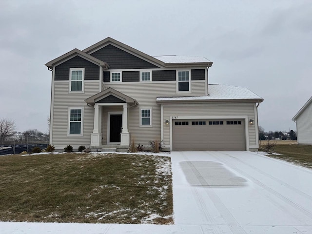 view of front facade with a garage and a front yard