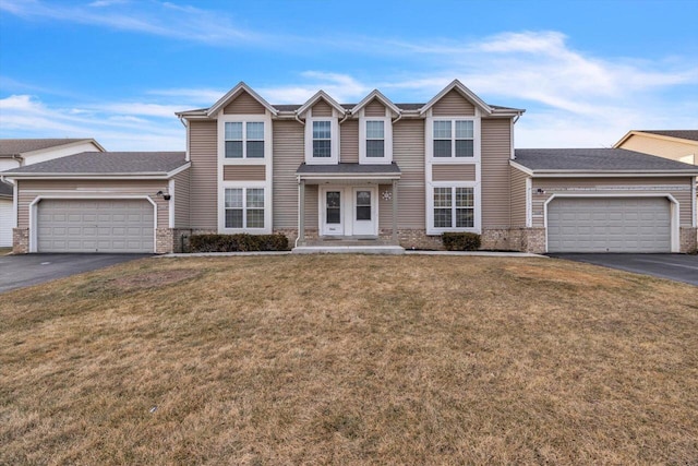 view of front facade with a garage and a front yard