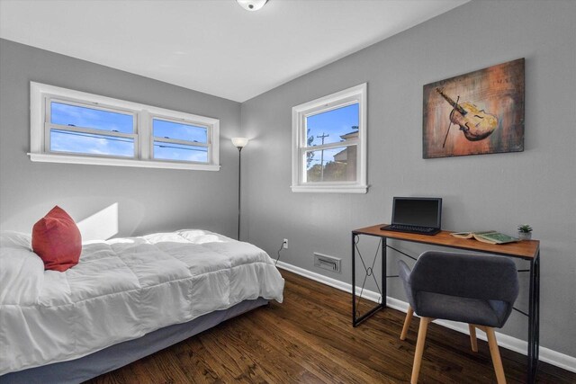 bedroom featuring dark hardwood / wood-style flooring