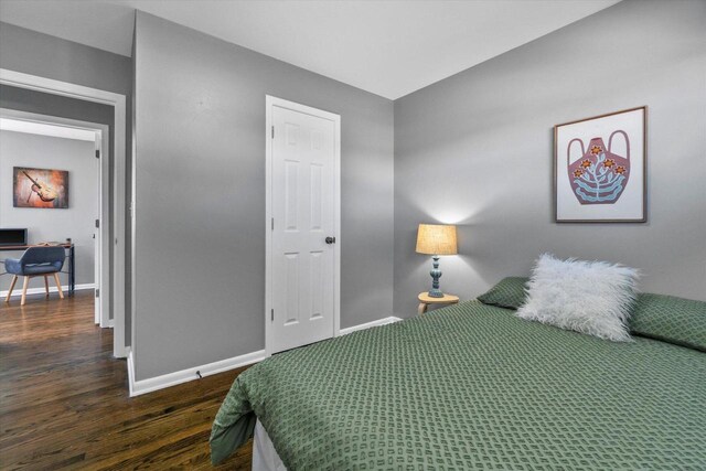 bedroom featuring dark hardwood / wood-style flooring