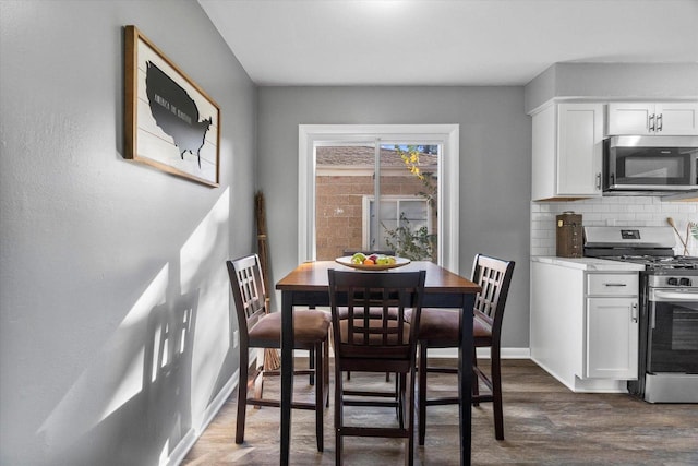 dining room featuring dark wood-type flooring