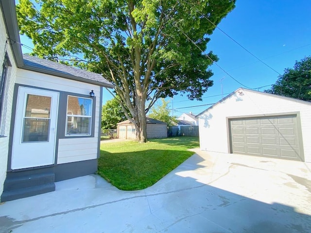 garage with a yard