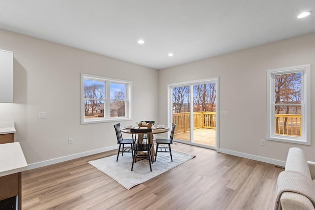 dining space featuring light hardwood / wood-style floors