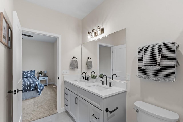 bathroom with tile patterned floors, vanity, and toilet