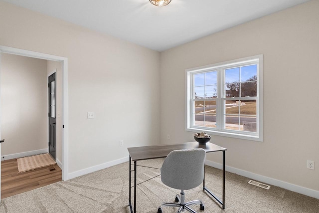 view of carpeted office space