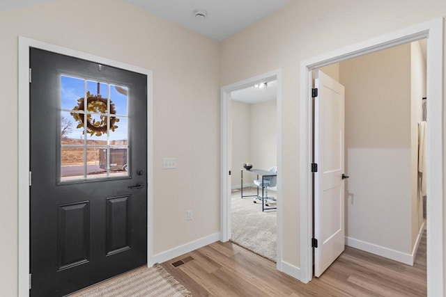 foyer with light hardwood / wood-style floors