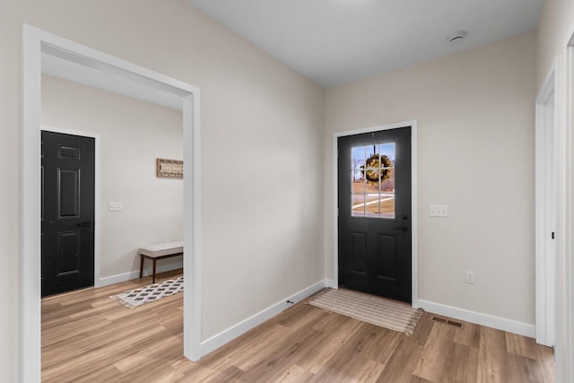 entrance foyer with light hardwood / wood-style floors