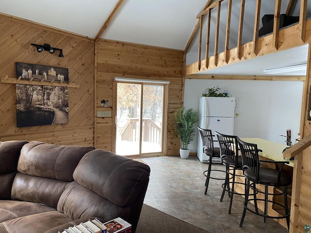 14239 S Eau Claire Acres, Gordon, WI 54838 - living room featuring lofted ceiling and wooden walls