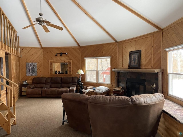 14239 S Eau Claire Acres, Gordon, WI 54838 - carpeted living room featuring a fireplace, vaulted ceiling, and ceiling fan
