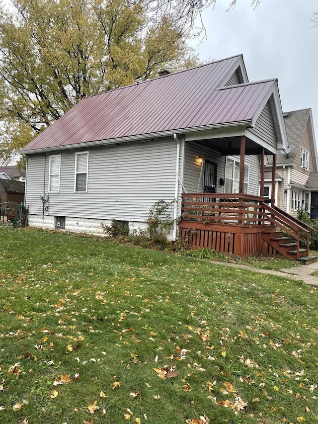 view of home's exterior with a lawn