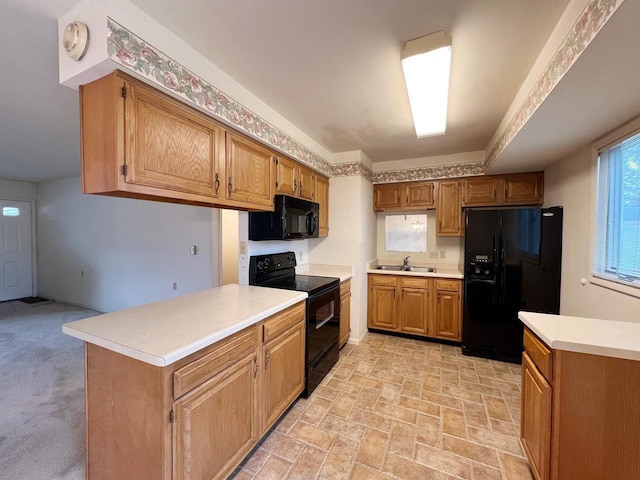 kitchen featuring black appliances and sink