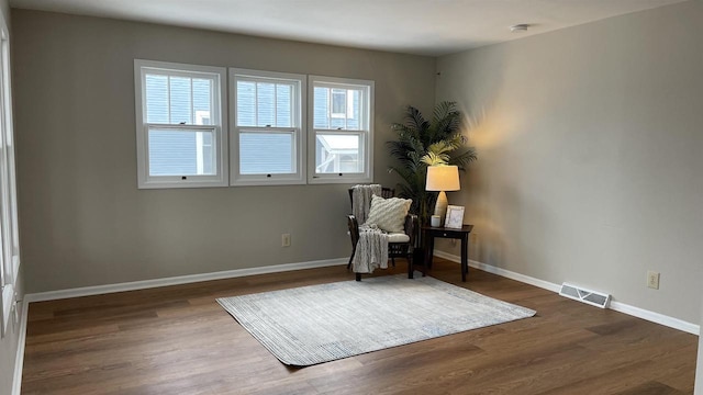 living area featuring hardwood / wood-style floors