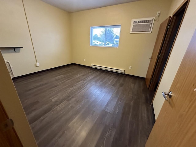 unfurnished bedroom with a wall unit AC, dark wood-type flooring, and a baseboard radiator