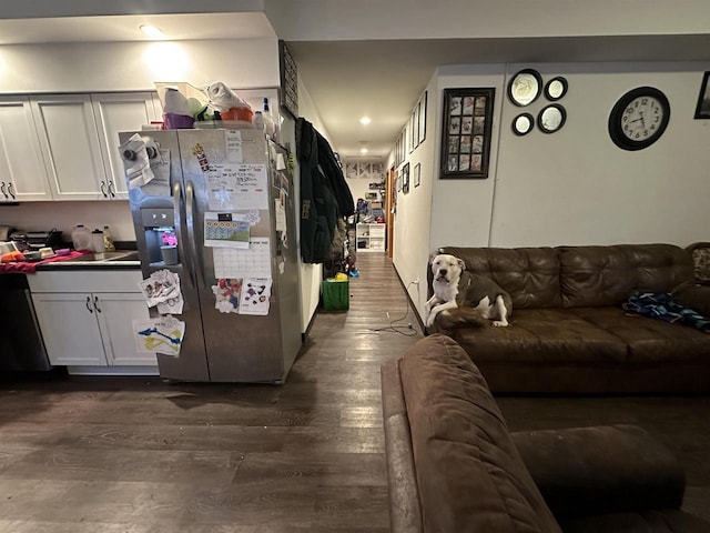 kitchen with white cabinetry, dishwasher, dark hardwood / wood-style floors, and stainless steel refrigerator with ice dispenser