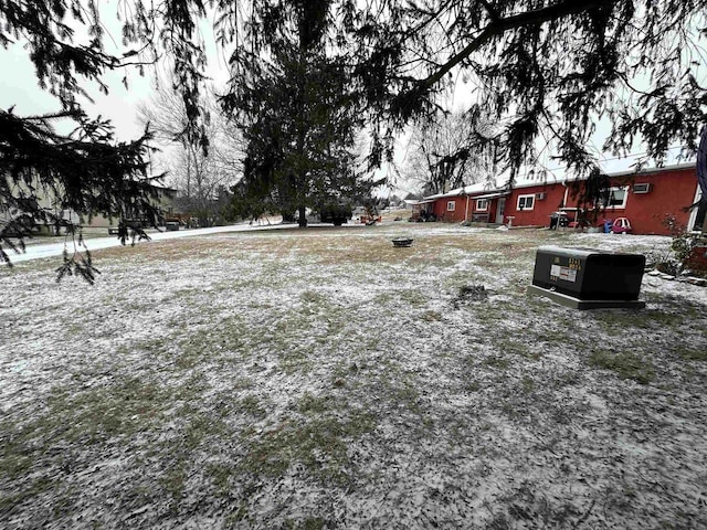 view of yard layered in snow