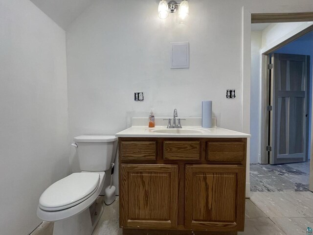 115 8th St E, Ashland, WI 54806 - half bathroom featuring toilet and vanity