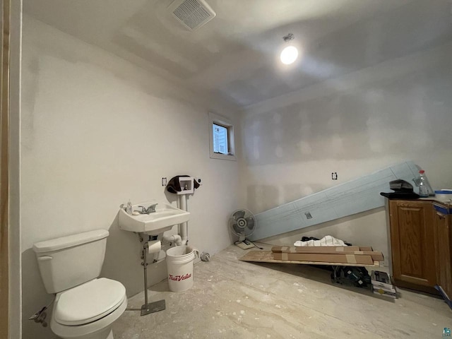 115 8th St E, Ashland, WI 54806 - bathroom featuring visible vents and toilet