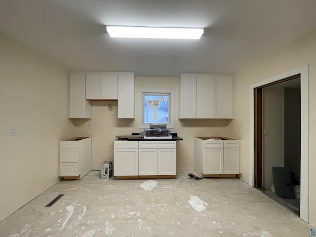 kitchen featuring white cabinetry