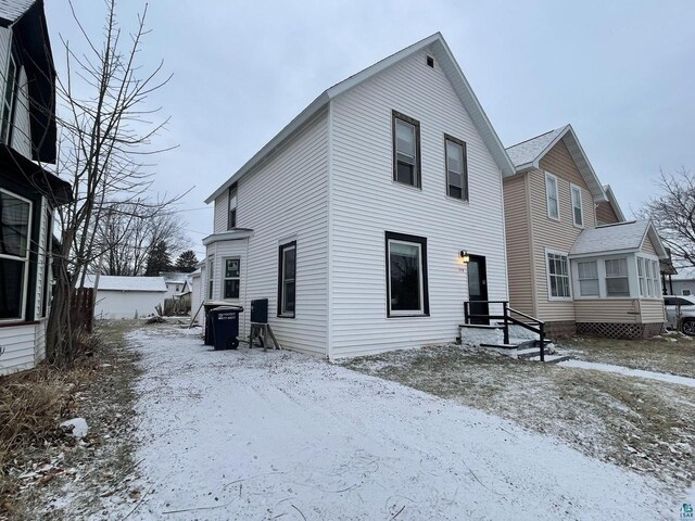 115 8th St E, Ashland, WI 54806 - view of snow covered house