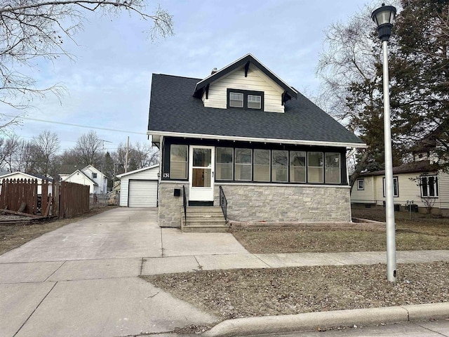 view of front of property featuring an outbuilding and a garage