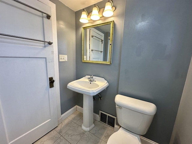 bathroom with sink and toilet