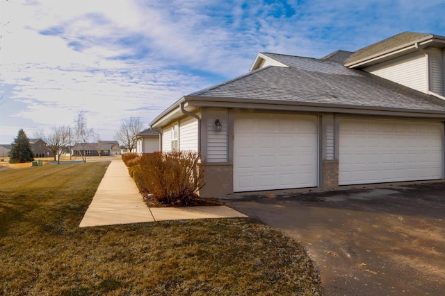 view of side of home featuring a garage