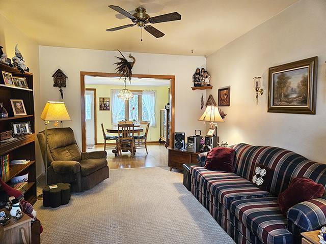 living room featuring ceiling fan