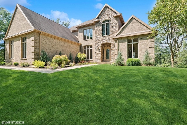 french country inspired facade with a front lawn