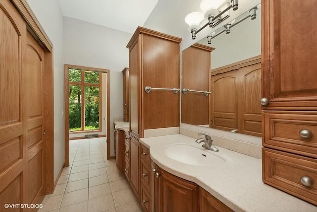 bathroom with vanity and tile patterned flooring