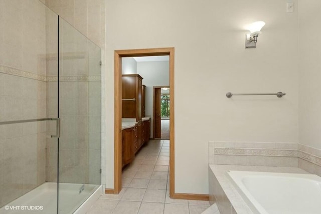 bathroom featuring plus walk in shower and tile patterned flooring