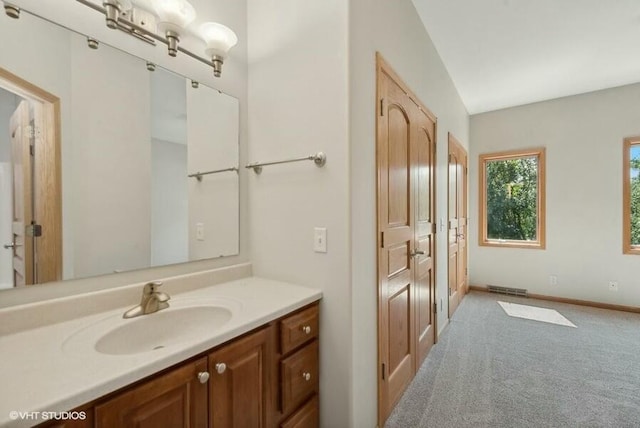 bathroom featuring vanity and vaulted ceiling