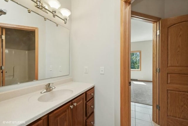 bathroom with vanity, tile patterned floors, and walk in shower