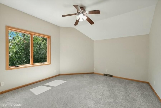 bonus room with light carpet, vaulted ceiling, and ceiling fan