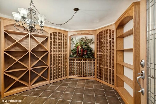 wine area featuring an inviting chandelier