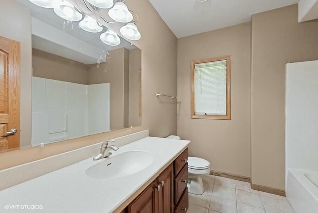 bathroom with vanity, tile patterned floors, and toilet