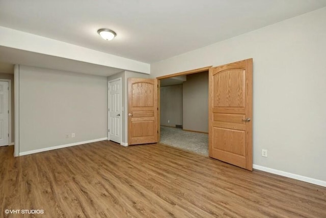 unfurnished bedroom with wood-type flooring