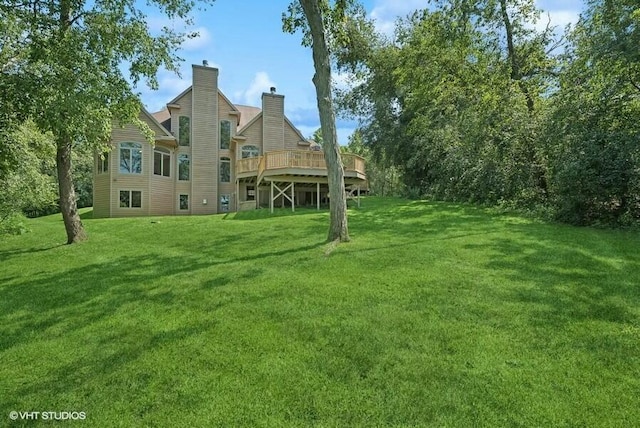 view of yard with a wooden deck