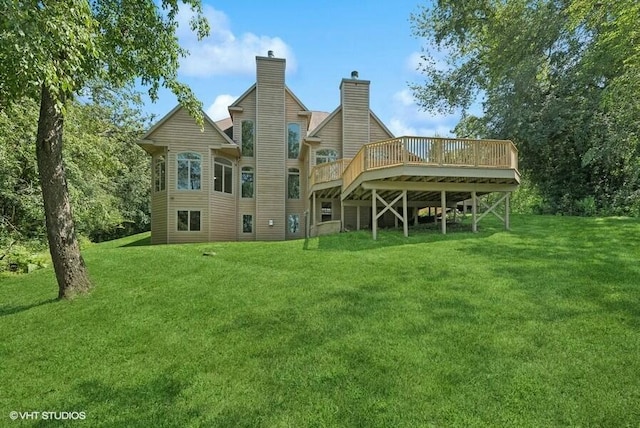 back of house featuring a yard and a deck