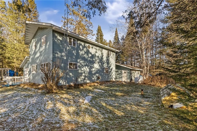 view of property exterior featuring a deck