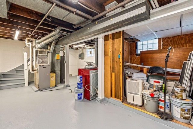 basement featuring heating unit and a wealth of natural light