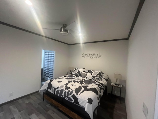 bedroom with dark hardwood / wood-style floors, ceiling fan, and crown molding