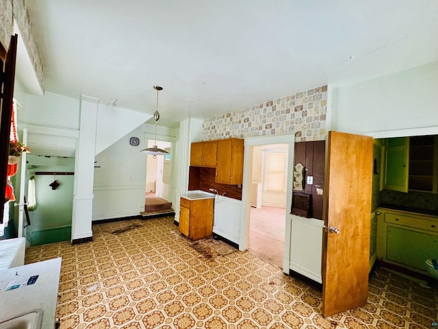 kitchen with decorative backsplash and decorative light fixtures