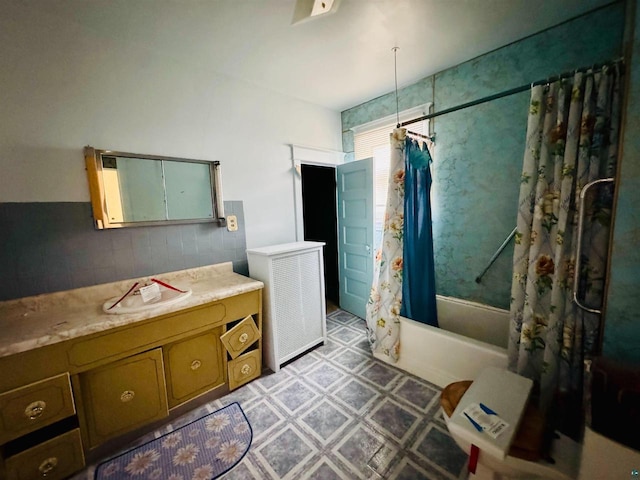 bathroom with shower / bath combo with shower curtain and vanity