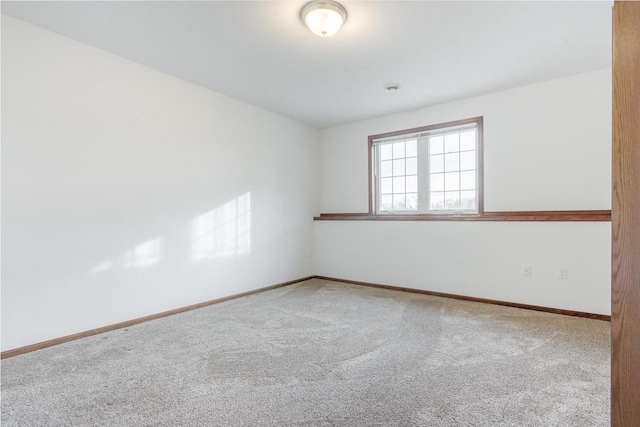 spare room featuring carpet floors