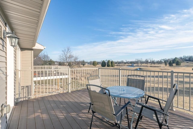 wooden terrace featuring a rural view